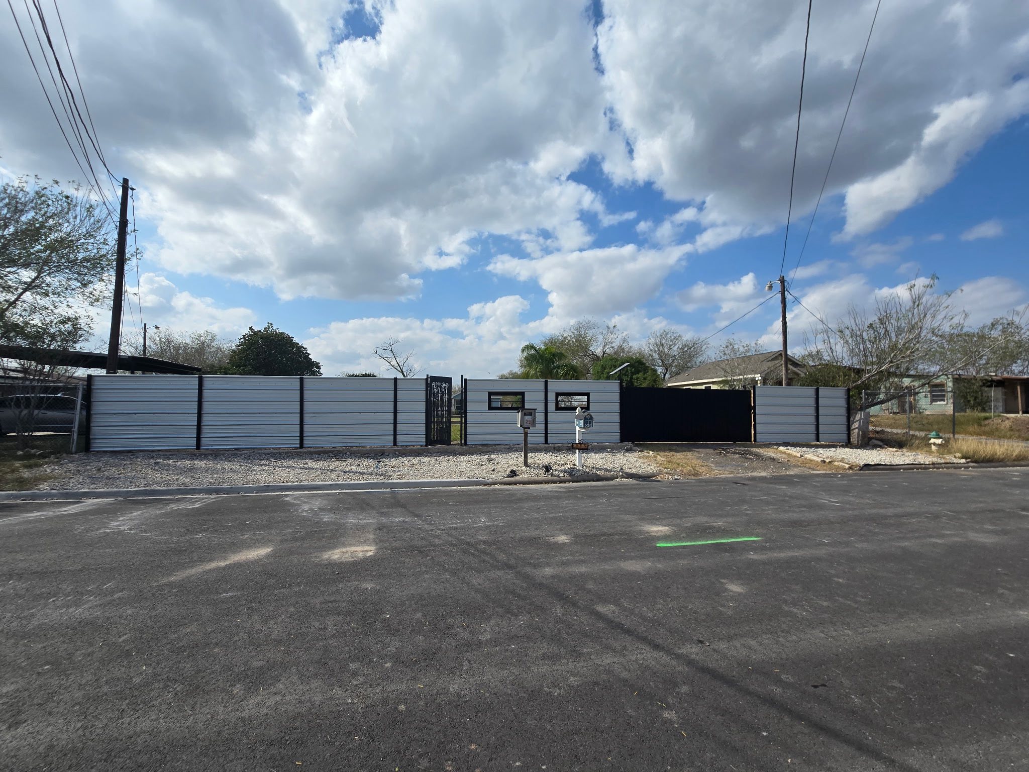 Commercial metal panel fence installation